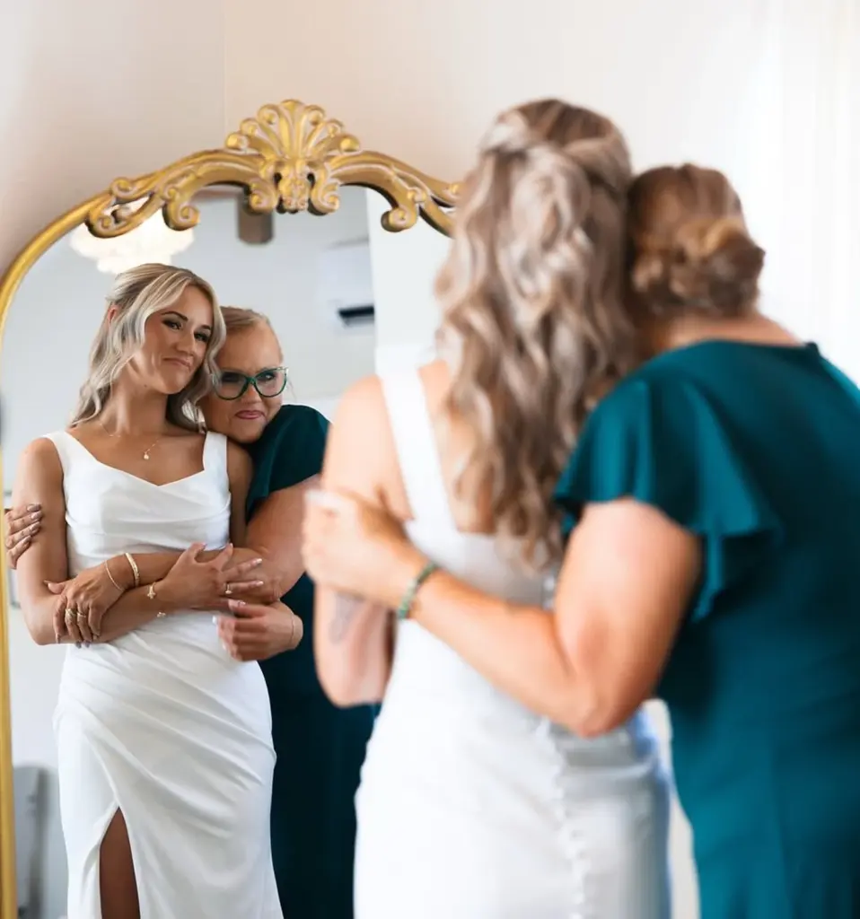 Bride posing with her mother
